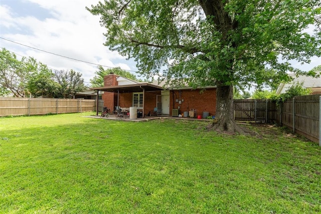 3217 NW 34th St, Oklahoma City, OK 73112 - view of yard with a patio