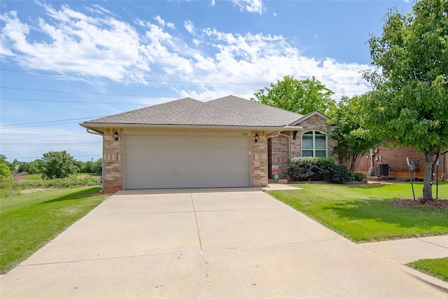 1528 Fawn Run Xing, Norman, OK 73071 - ranch-style house with a garage, driveway, a front yard, and central AC