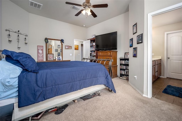 1528 Fawn Run Xing, Norman, OK 73071 - bedroom featuring light carpet, baseboards, a ceiling fan, and ensuite bathroom
