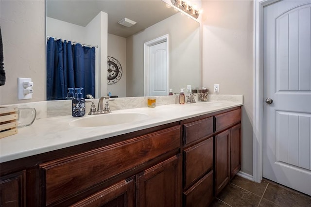 1528 Fawn Run Xing, Norman, OK 73071 - bathroom with double vanity, tile patterned flooring, and baseboards