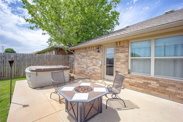 1528 Fawn Run Xing, Norman, OK 73071 - view of patio with a hot tub, an outdoor fire pit, and fence
