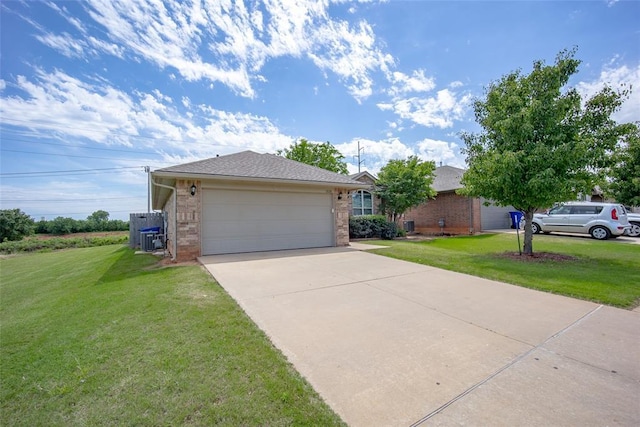 1528 Fawn Run Xing, Norman, OK 73071 - ranch-style home with brick siding, a front yard, driveway, and a garage