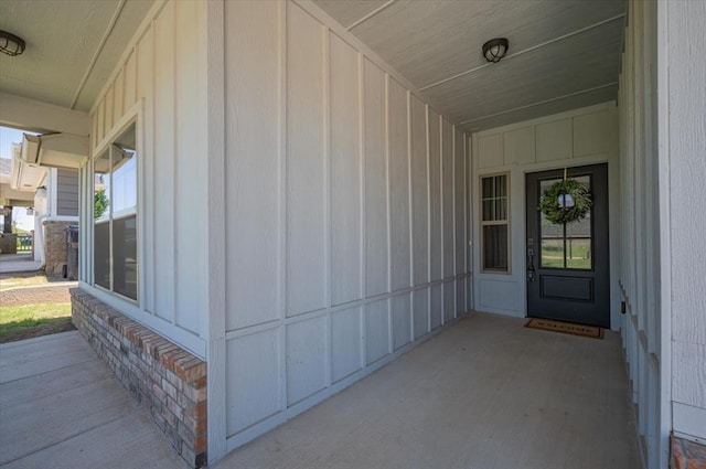 12824 NW 4th Ter, Yukon, OK 73099 - view of exterior entry with board and batten siding