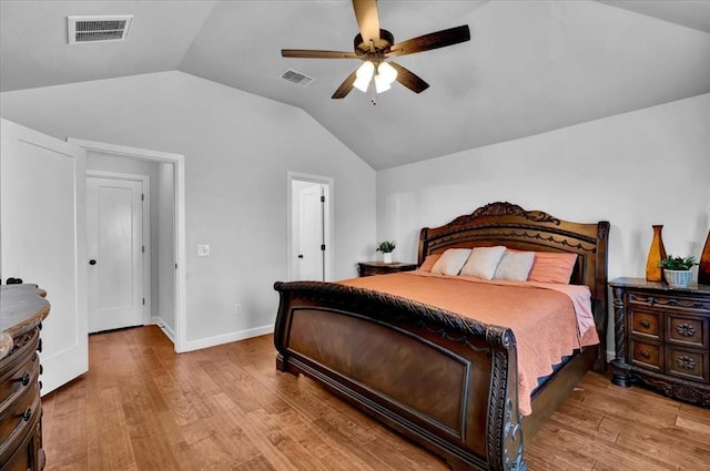 12824 NW 4th Ter, Yukon, OK 73099 - bedroom with lofted ceiling, wood finished floors, a ceiling fan, and baseboards