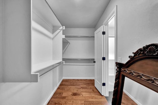 12824 NW 4th Ter, Yukon, OK 73099 - walk in closet with wood finished floors