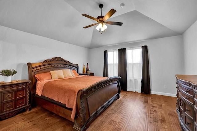 12824 NW 4th Ter, Yukon, OK 73099 - bedroom with vaulted ceiling, hardwood / wood-style flooring, a ceiling fan, and baseboards