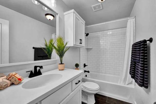 12824 NW 4th Ter, Yukon, OK 73099 - bathroom with vanity, shower / tub combo, toilet, and tile patterned floors