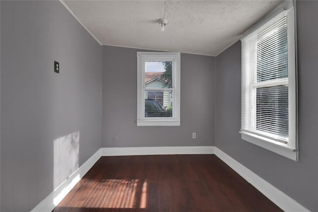 6017 Pat Ave, Oklahoma City, OK 73149 - empty room with wood finished floors, a textured ceiling, and baseboards