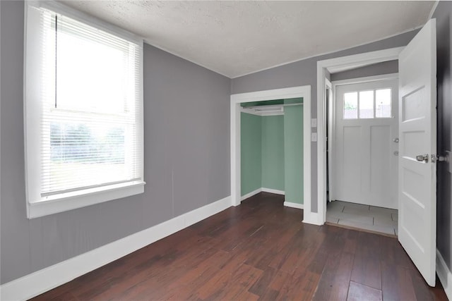 6017 Pat Ave, Oklahoma City, OK 73149 - entrance foyer featuring dark wood-type flooring and baseboards