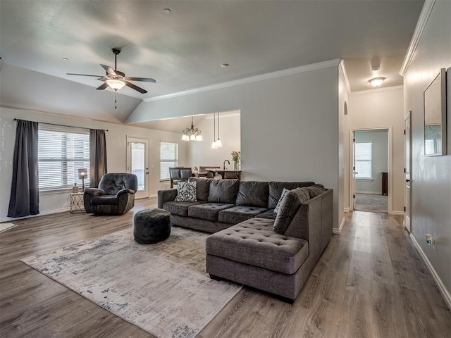 12005 NW 139th St, Piedmont, OK 73078 - living room featuring a ceiling fan, healthy amount of natural light, a chandelier, baseboards, and crown molding
