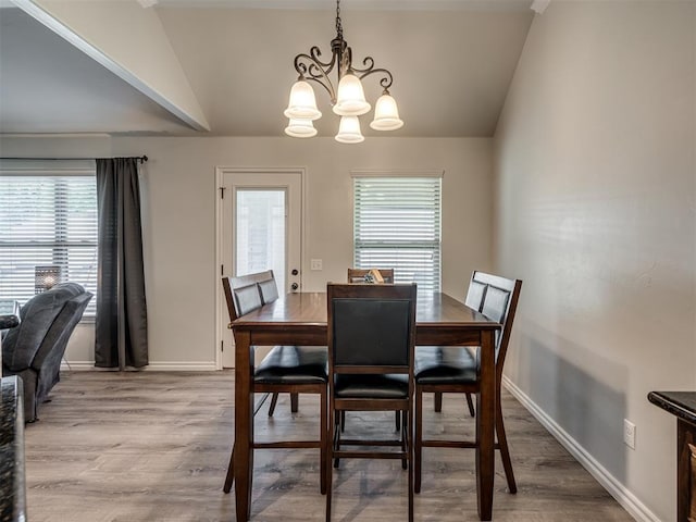 12005 NW 139th St, Piedmont, OK 73078 - dining room featuring lofted ceiling, a chandelier, plenty of natural light, light wood finished floors, and baseboards