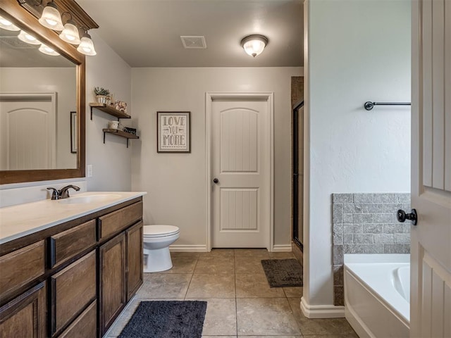 12005 NW 139th St, Piedmont, OK 73078 - bathroom with vanity, a shower stall, a bath, toilet, and tile patterned flooring