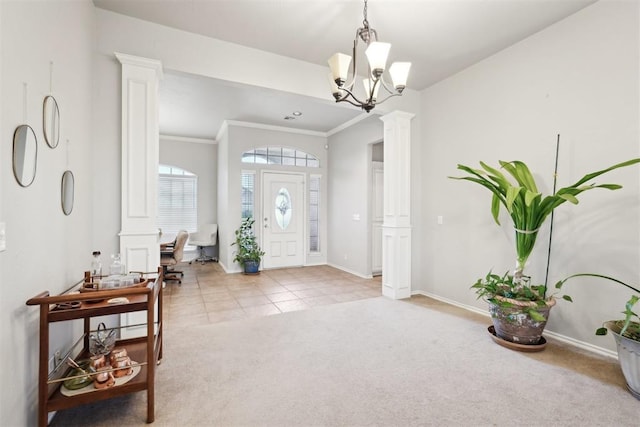 1701 Tifton Dr, Edmond, OK 73012 - entryway featuring ornate columns, light carpet, baseboards, light tile patterned floors, and ornamental molding