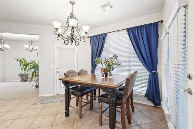 1701 Tifton Dr, Edmond, OK 73012 - dining area featuring a chandelier, baseboards, and plenty of natural light