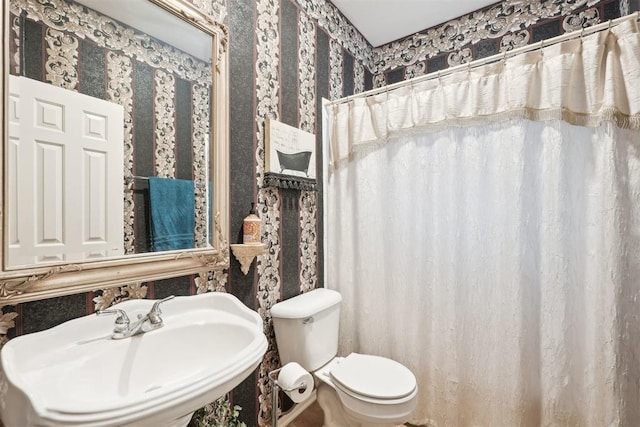 1701 Tifton Dr, Edmond, OK 73012 - full bathroom with a sink, toilet, and wallpapered walls