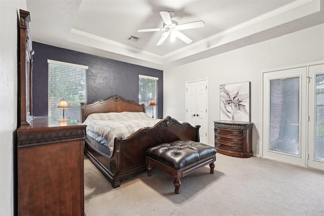 1701 Tifton Dr, Edmond, OK 73012 - carpeted bedroom featuring access to outside, a raised ceiling, multiple windows, crown molding, and ceiling fan