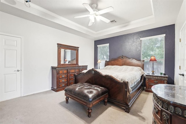 1701 Tifton Dr, Edmond, OK 73012 - bedroom featuring light colored carpet, a raised ceiling, ornamental molding, and a ceiling fan