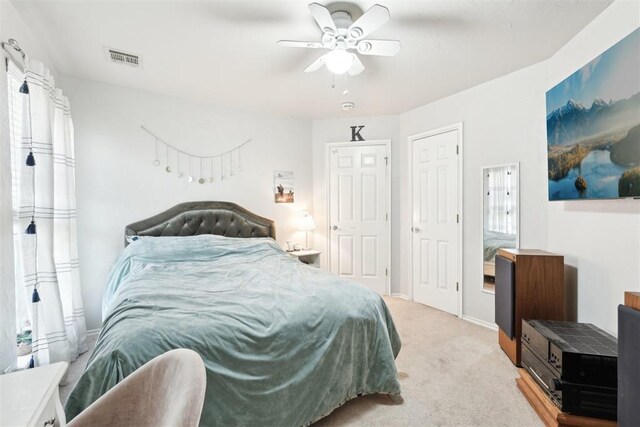 1701 Tifton Dr, Edmond, OK 73012 - bedroom with light colored carpet and a ceiling fan