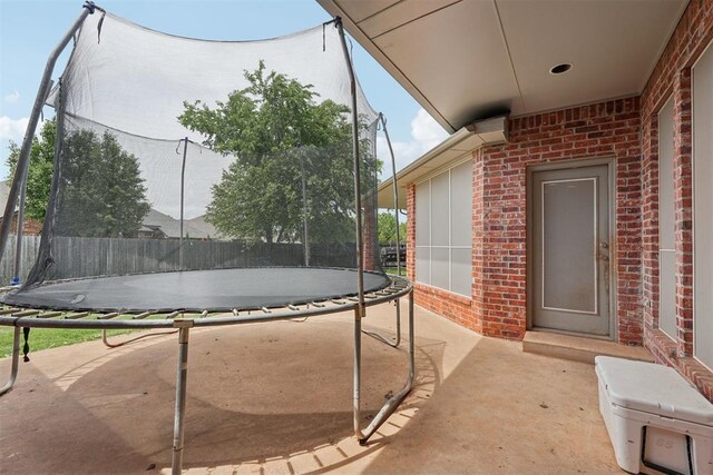 1701 Tifton Dr, Edmond, OK 73012 - view of patio featuring a trampoline
