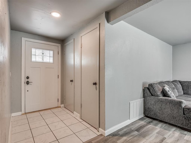 813 Branchwood Ct, Norman, OK 73072 - foyer entrance with baseboards and light wood-style flooring