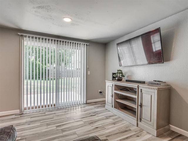 813 Branchwood Ct, Norman, OK 73072 - bar with light wood-style flooring, baseboards, and recessed lighting