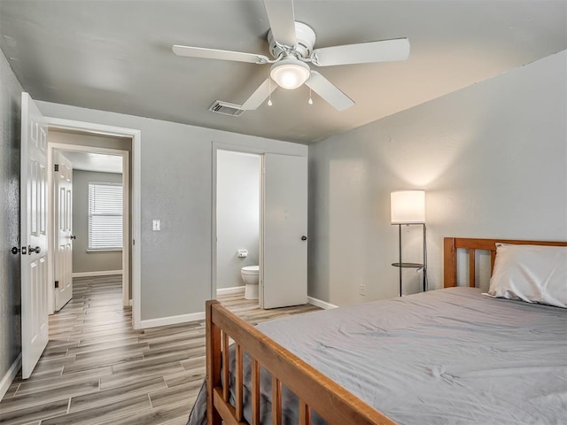 813 Branchwood Ct, Norman, OK 73072 - bedroom featuring baseboards, light wood-style flooring, and connected bathroom