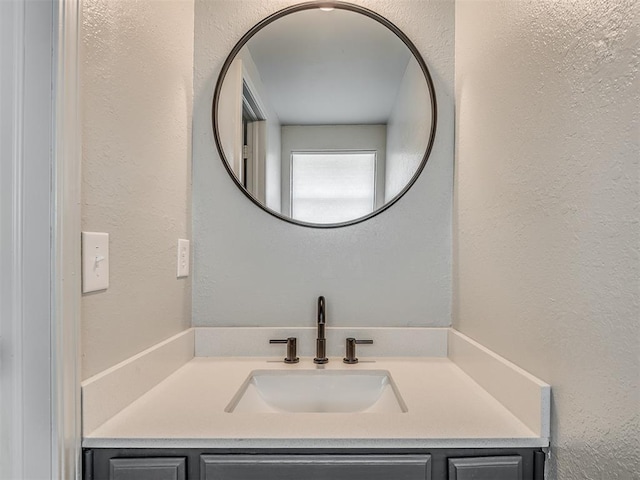 813 Branchwood Ct, Norman, OK 73072 - bathroom featuring vanity and a textured wall