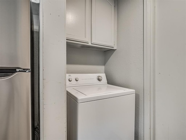 813 Branchwood Ct, Norman, OK 73072 - laundry room featuring washer / clothes dryer and cabinet space