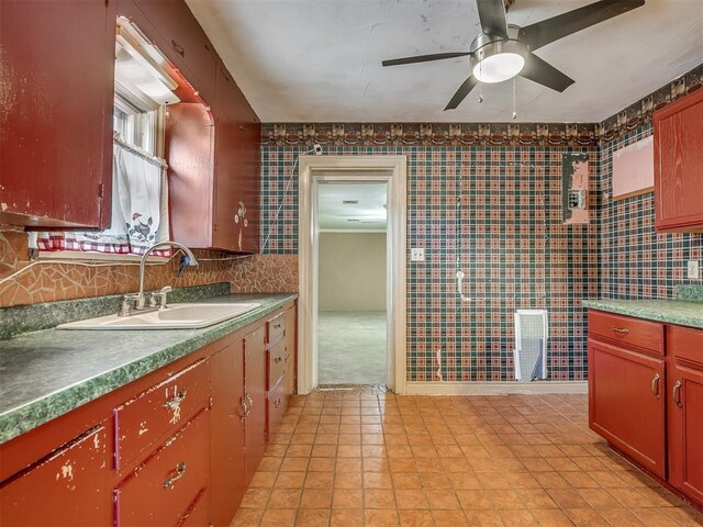1132 SW 25th St, Oklahoma City, OK 73109 - kitchen with a sink, ceiling fan, and wallpapered walls