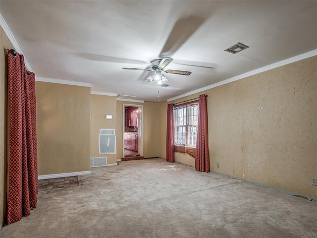 1132 SW 25th St, Oklahoma City, OK 73109 - carpeted spare room with ceiling fan, ornamental molding, and a textured wall