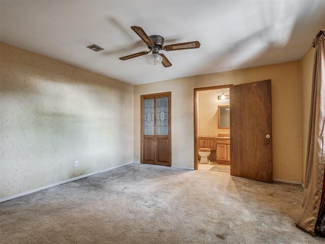 1132 SW 25th St, Oklahoma City, OK 73109 - empty room with a ceiling fan, light carpet, and baseboards