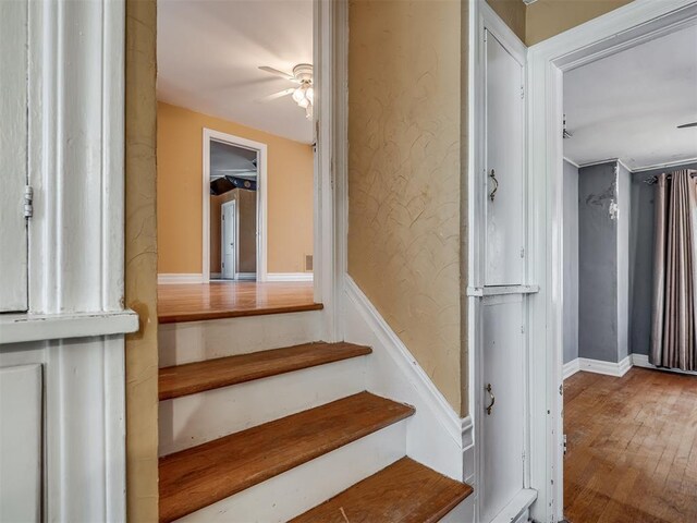 1132 SW 25th St, Oklahoma City, OK 73109 - stairs with ceiling fan and wood finished floors