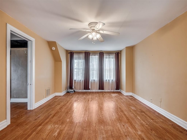 1132 SW 25th St, Oklahoma City, OK 73109 - spare room with light wood finished floors, ceiling fan, and baseboards