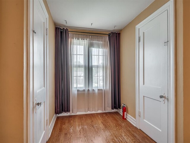 1132 SW 25th St, Oklahoma City, OK 73109 - empty room featuring wood finished floors and baseboards