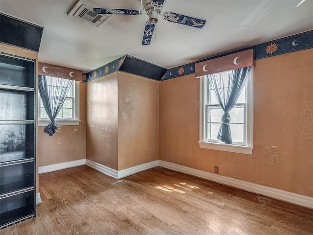 1132 SW 25th St, Oklahoma City, OK 73109 - unfurnished room with wood finished floors, a ceiling fan, and baseboards