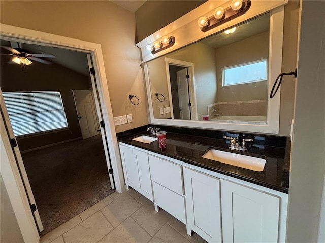 11308 NW 103rd St, Yukon, OK 73099 - bathroom with double vanity, a bath, ceiling fan, and tile patterned floors
