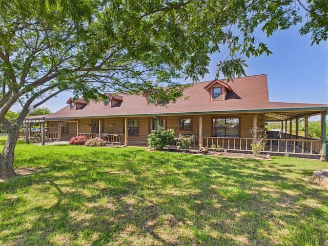 back of house featuring a lawn and a porch