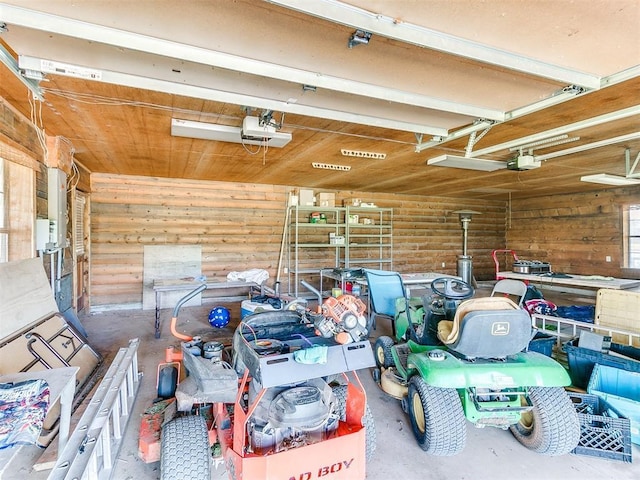 garage featuring a garage door opener and wood ceiling