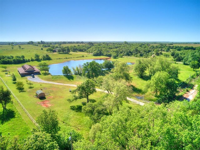 aerial view of sparsely populated area featuring a nearby body of water