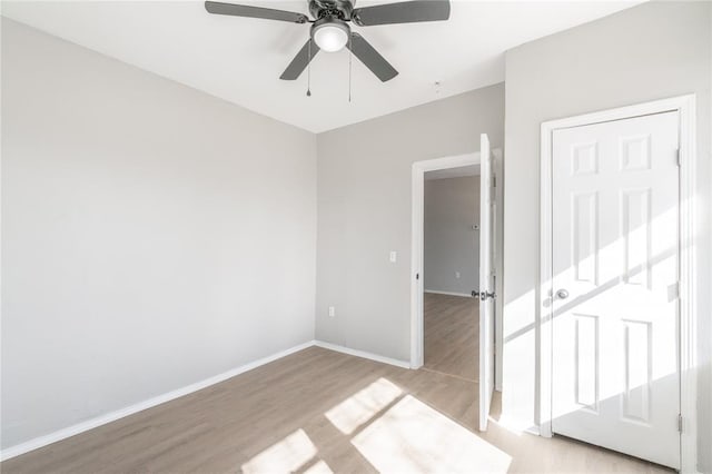 1925 NW 36th St, Oklahoma City, OK 73118 - unfurnished bedroom with light wood finished floors, baseboards, and a ceiling fan