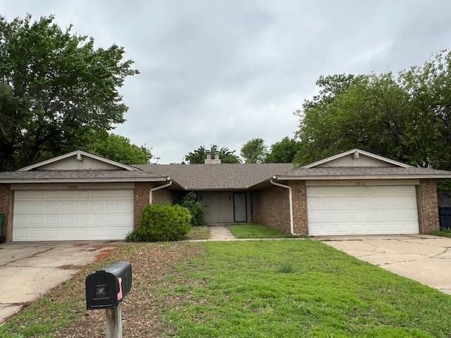7909 Harvest Moon Rd, Oklahoma City, OK 73132 - ranch-style home with brick siding, an attached garage, driveway, and a front yard