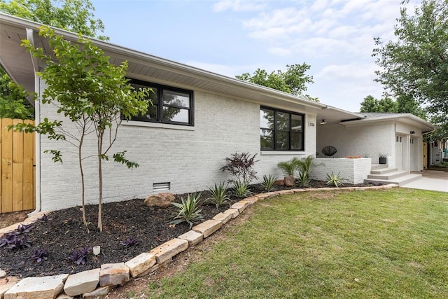 3236 NW 68th St, Oklahoma City, OK 73116 - view of front of home featuring crawl space, a garage, a front yard, and brick siding