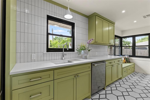 3236 NW 68th St, Oklahoma City, OK 73116 - kitchen featuring green cabinetry, a sink, stainless steel dishwasher, light countertops, and recessed lighting