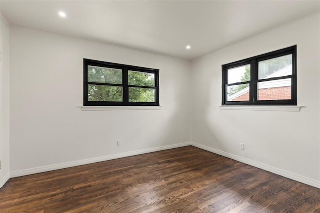 3236 NW 68th St, Oklahoma City, OK 73116 - spare room with dark wood-style flooring, crown molding, baseboards, and recessed lighting