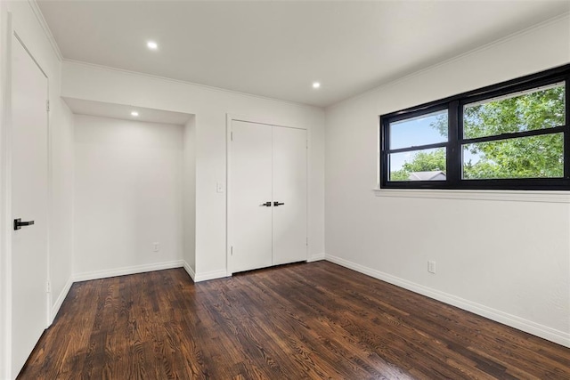 3236 NW 68th St, Oklahoma City, OK 73116 - unfurnished bedroom featuring dark wood-type flooring, crown molding, baseboards, recessed lighting, and a closet