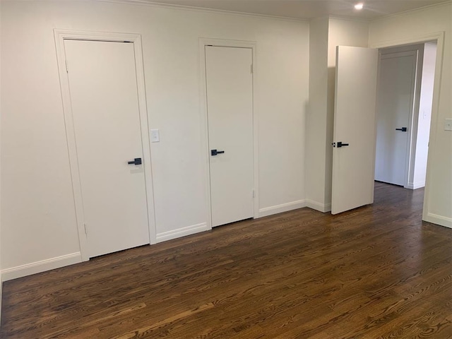 3236 NW 68th St, Oklahoma City, OK 73116 - unfurnished bedroom with dark wood-style flooring, baseboards, and ornamental molding