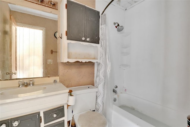 full bathroom with vanity, shower / tub combo, and toilet