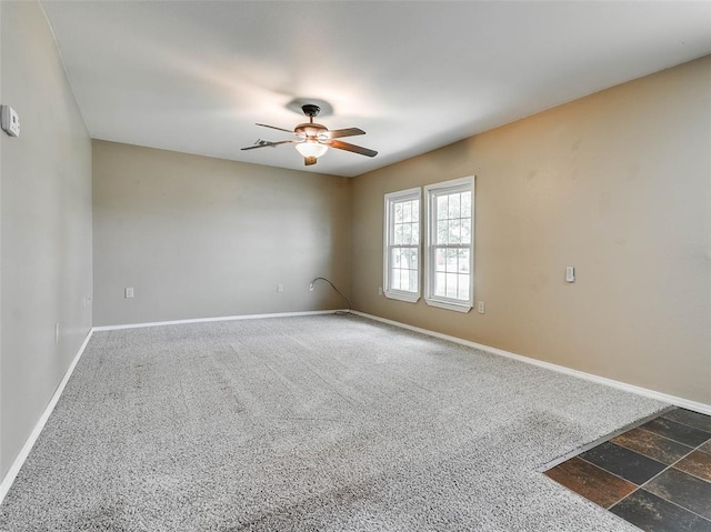 922 W 7th St, Stroud, OK 74079 - unfurnished room with a ceiling fan, baseboards, and carpet floors