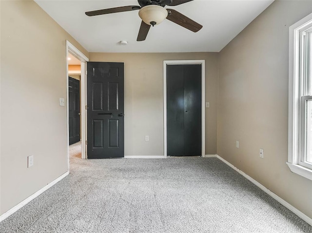 922 W 7th St, Stroud, OK 74079 - unfurnished bedroom with carpet, baseboards, and ceiling fan