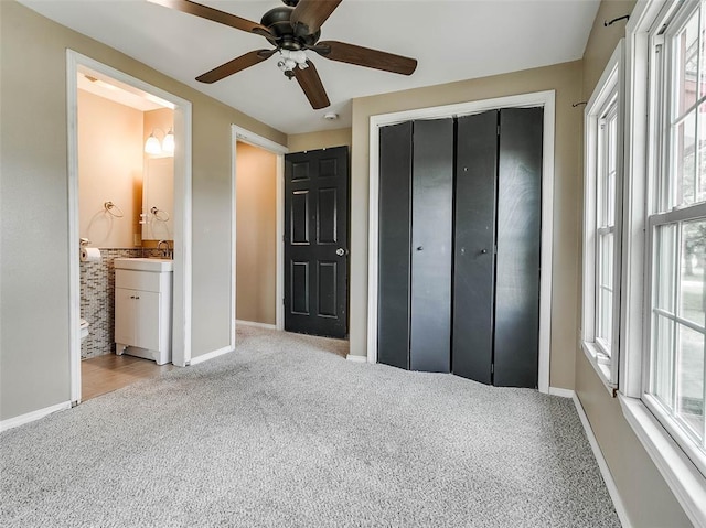 922 W 7th St, Stroud, OK 74079 - unfurnished bedroom with carpet floors, baseboards, a closet, and a sink